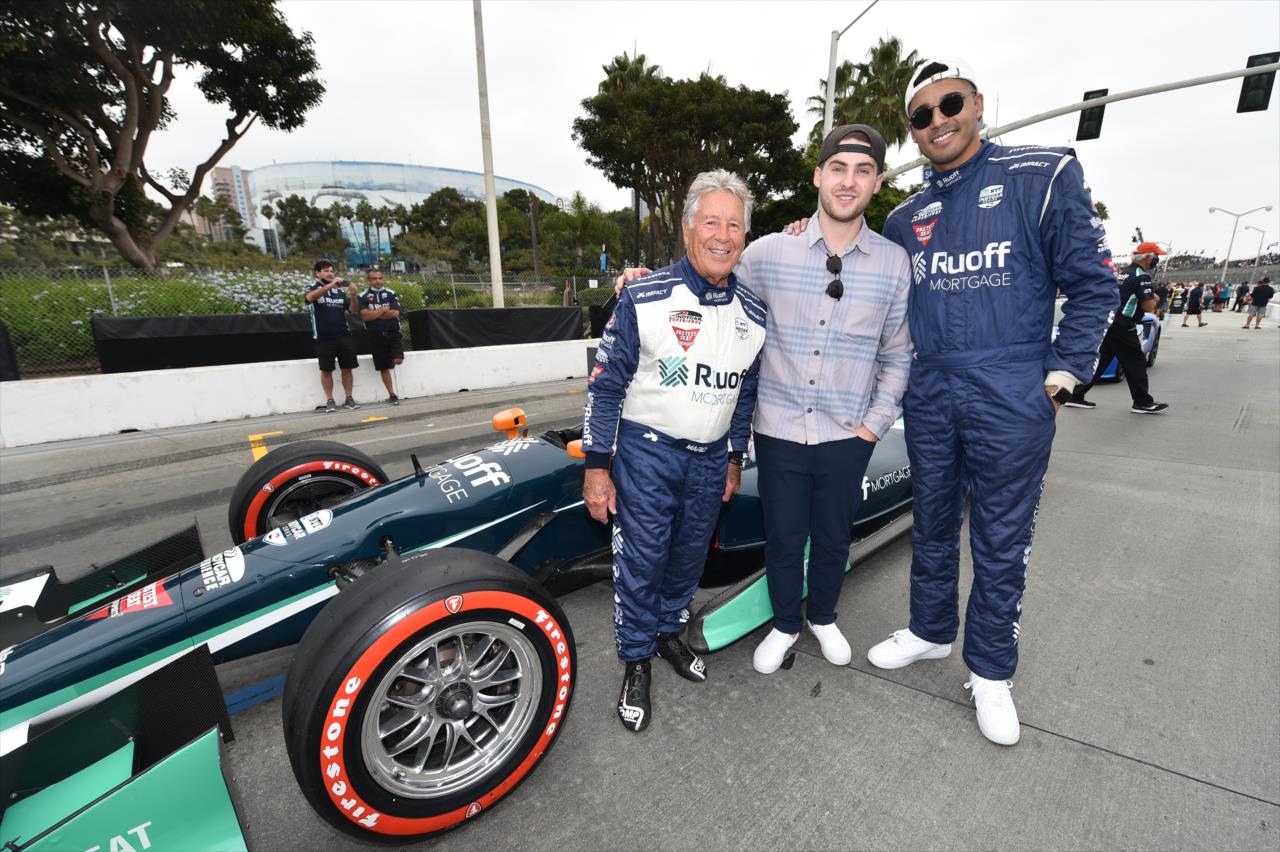 Mario Andretti, Cody Christian and Michael Evans Behling pose with the Ruoff Fastest Seat In Sports - Acura Grand Prix of Long Beach -- Photo by: Chris Owens